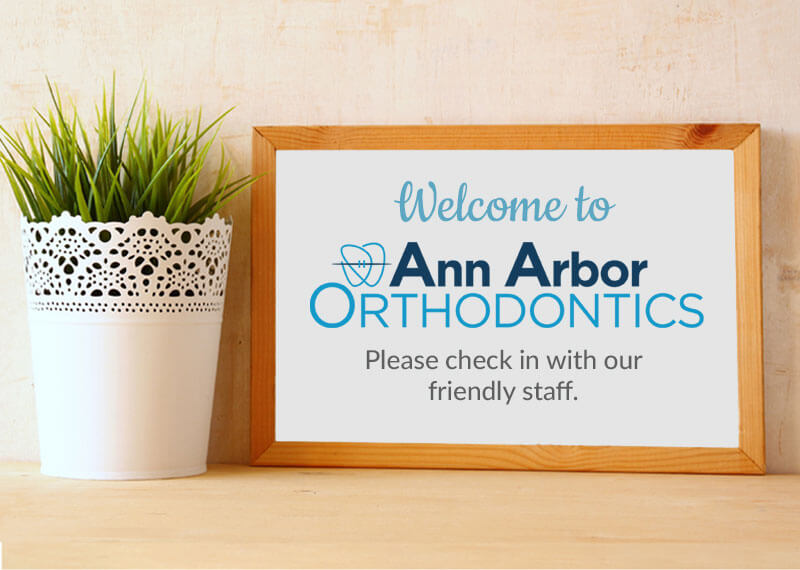 welcome sign on our desk